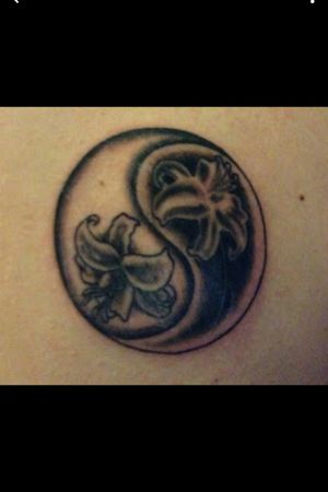  A ying-yang tattoo with Lotus flowers inside :)
