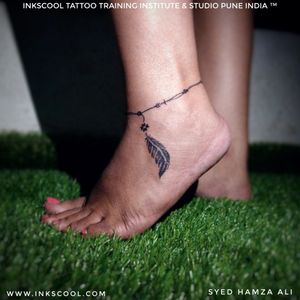 Ankle feather tattoo designed and created by tattoo artist Syed Hamza Ali at INKSCOOL Tattoo Training Institute And Studio Pune India ™. 