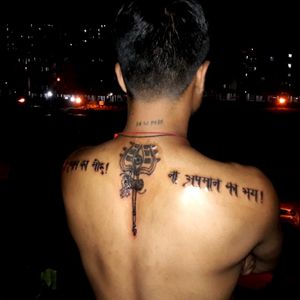 Trident with powerful words tattoo