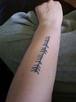 My first one, drew it myself and a friend tattooed me in the army. Leaf-rune that spells my name
