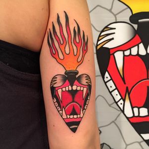 Roar of devotion. Tattoo by Max Newton #maxnewtown #sacredhearttattoo #color #traditional #heart #jaguar #roar #cat #fangs #fire #love