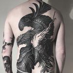 Carrying the torch. Tattoo by Alexander Grim #AlexanderGrim #besttattoos #blackandgrey #eagle #torch #fire #bird #feathers #wings