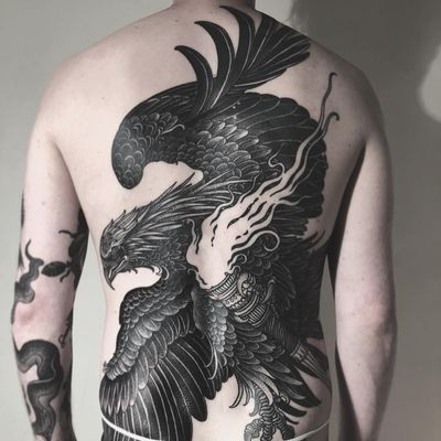 Carrying the torch. Tattoo by Alexander Grim #AlexanderGrim #besttattoos #blackandgrey #eagle #torch #fire #bird #feathers #wings
