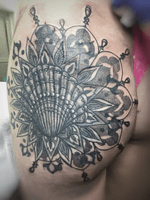 Ornamental dotwork mandala seashell blackwerk booty tattoo
