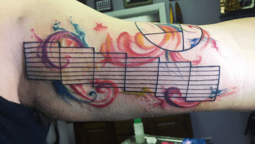 Photography aperture watercolor tattoo