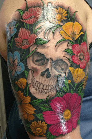 Realistic wild flower and skull half sleeve. Artist: Chad Saucier, Lake City, FL
