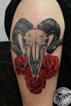 Aries skull with roses.