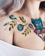 By Pis Saro #flower #floral #chesttattoo #color 