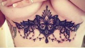 Butterfly lace under boob tattoo