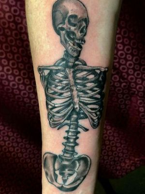 Skull and ribcage piece by Jordyn Grine Tattoo  from 22 Caliber Tattoos in Hilliard #blackandgrey #skeleton #skulltattoo #detail #ribcage