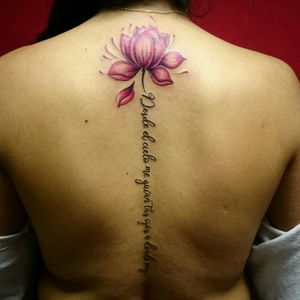 Lotus and phrase tattoo