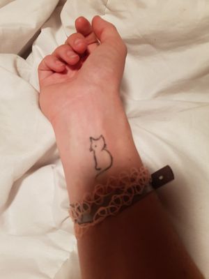 Tiny cat tattoo