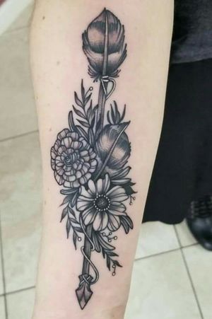forearm tattoo. Done by Andi Fitzpatrick at Studio 13, Fort Wayne Indiana. #flowerstattoo #arrow #feathers  #blackandgreytattoo #forearmtattoo 