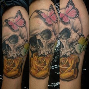 Skull, roses and butterflies in color. 