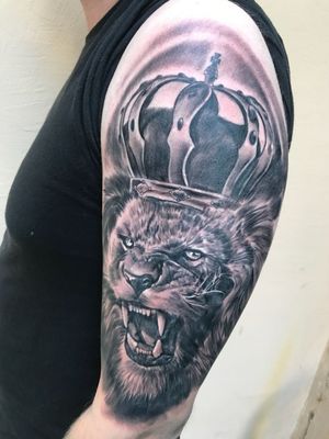 Roaring Lion with crown tattoo 