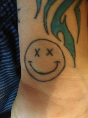 My second tattoo means happy on the outside dead on the inside artist name was shea