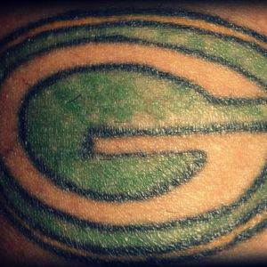 My (awful) Green Bay tattoo. I'm getting it fixed before my next tattoo.#uglytattoos #messedup #redo 