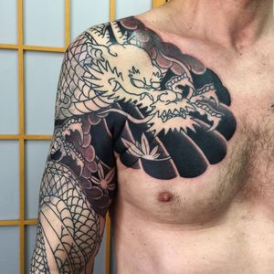 Tattoo by Sergey Buslay #SergeyBuslay #tattoodoambassador #Japanese #irezumi #dragon #chestpiece #mapleleaves #coveruptattoo #coverup #clouds #leaves #mythicalcreature #folklore
