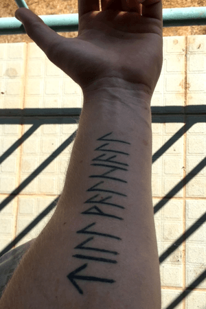 “Till Valhalla” written in Nordic runes.