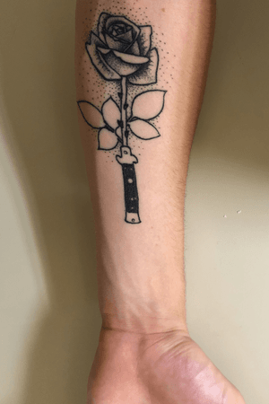 Switchblade into a thorned rose. Done by Logan Johnson