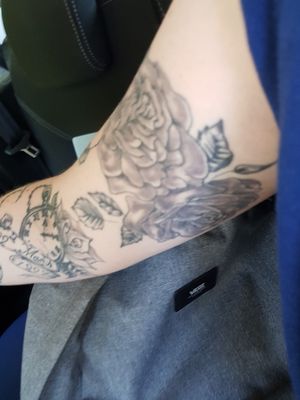 roses on upper left arm 