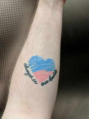 #Pink and #blue heart with "always in our hearts" in cursive wrapped around the bottom of the #heart.Left inner #forearm#text #remembrancetattoo #inmemory 