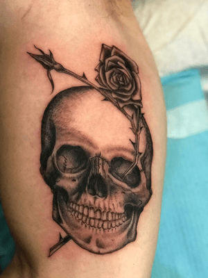 Skull and rose on inner bicep