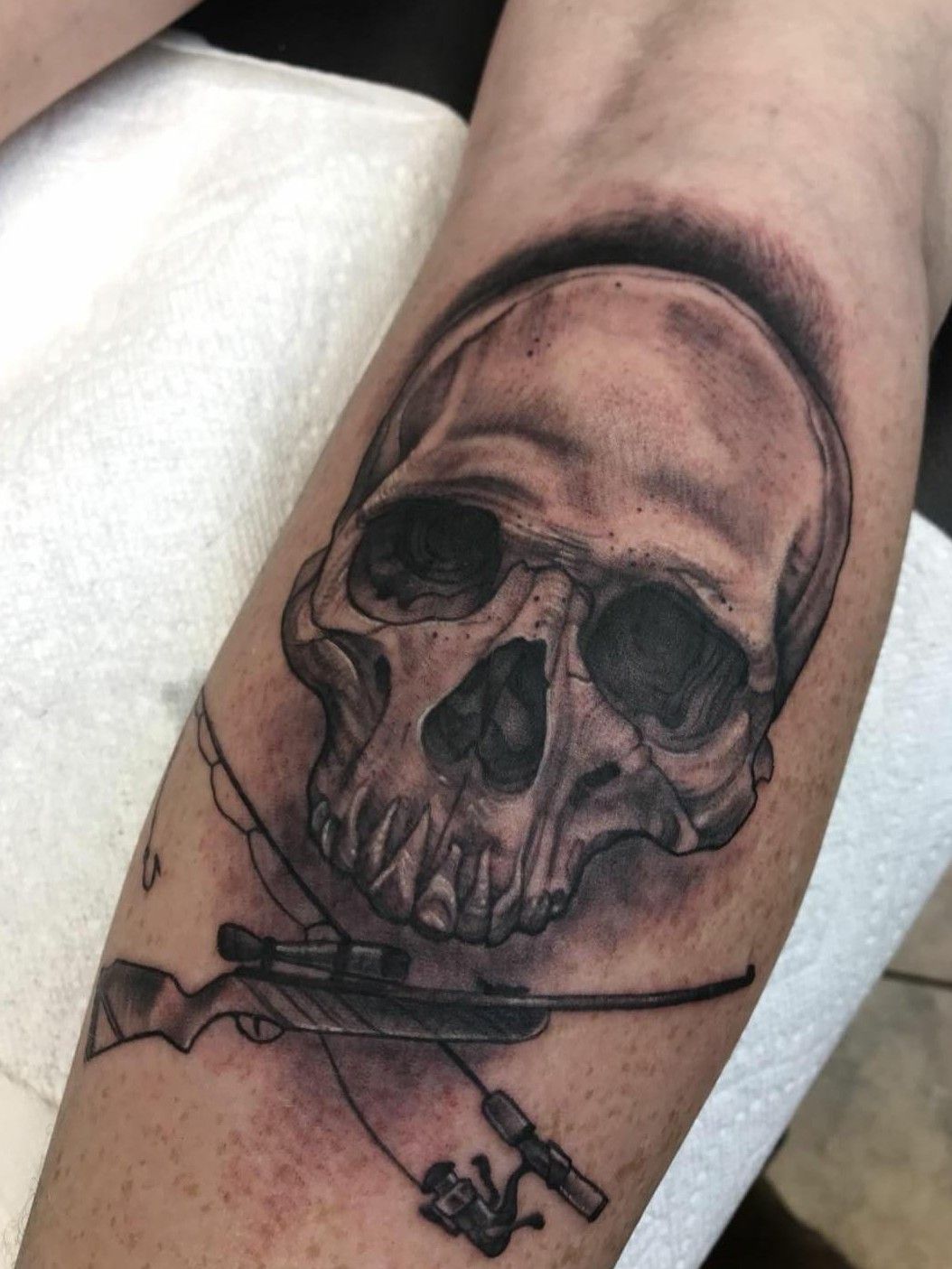 Tattoo uploaded by Madog561 • Second overall piece first on my leg Its a  skull and cross bones with a fishing pole and a rifle as the bones •  Tattoodo