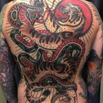 Tattoo by Adam Truarn #AdamTruarn #favoritetattoos #color #traditional #tiger #snake #reptile #animal #fight #nature #backpiece #backtattoo