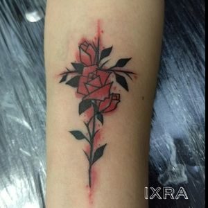 Abstract rose and cross tattoo