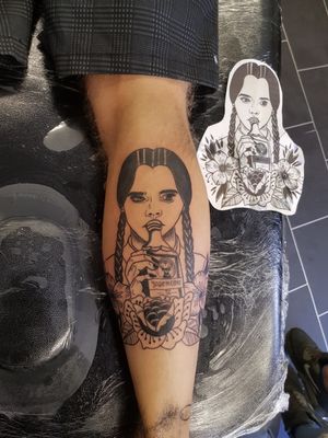 Wednesday Addams drinking a bottle of jagermeister . A tribute to my fiancée who has the perfect resting bitch face and a taste for jager. Courtesy of Twisted Rose tattoos