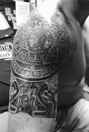 Based on an aztec sun dial