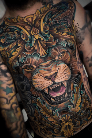 Full front ornamental lion and snake tattoo