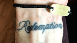 “Redemption” wrist tattoo