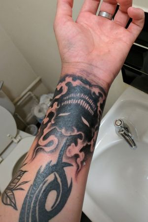 First wrist tattoo, smoke rises up to fill in sleeve
