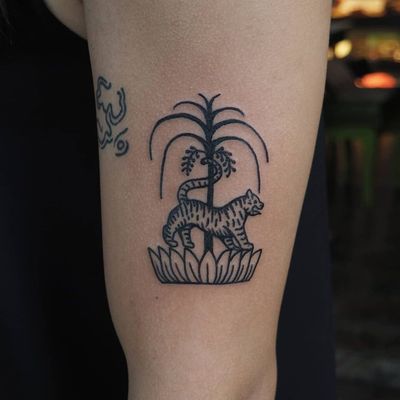 Tattoo by Or Kantor #OrKantor #junglecattattoos #linework #cat #tiger #Thai #lotus #flower #India #tree #illustrative #simple