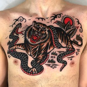 Flash by Tex Rowe. Tattoo by Francesco Ferrara #FrancescoFerrara #TexRowe #Junglecattattoos #junglecat #color #traditional #snake #tiger #leaf #nature #jungle #fight #nature