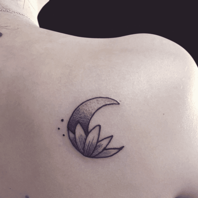 Fine line moon lotus flower and star tattoo located on