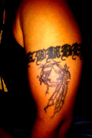 Lumbee in old English-language with a dream catcher, I've had this one for some time now but it was the first tattoo I ever got...