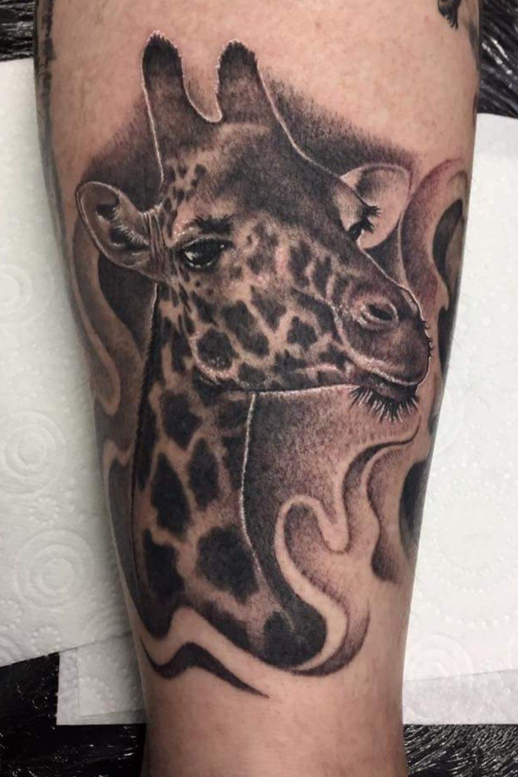 Microrealistic giraffe tattoo on the inner forearm