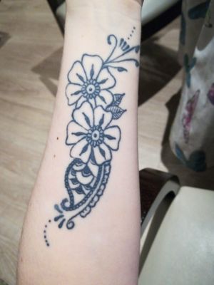 Flower design on left wrist 