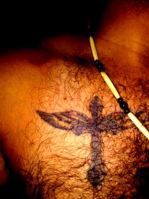 I'm a hairy guy I know lol...but it's a custom cross with eagle wings, the inscription is Isaiah 40; 31