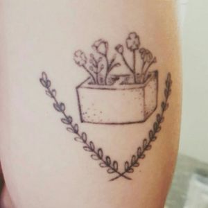 A very neat tattoo representing All Time Low's song Cinderblock Garden