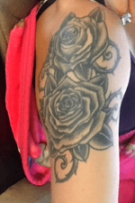 Two large roses on my right shoulder, done by Don Morley in Ogdensburg NY! 