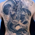 Tattoo by Oozy #Oozy #dragontattoos #blackandgrey #dragon #mythicalcreature #beast #monster #animal #waves #Japanese #illustrative #backtattoo #backpiece