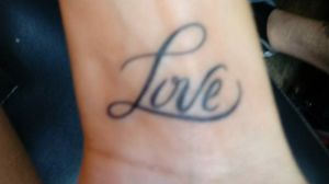 Love wrist tattoo 