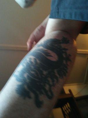 Dragon tattoo on calf muscle