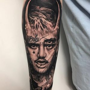 Tattoo by Anrijs Straume #AnrijsStraume #musictattoos #blackandgrey #realism #hyperrealism #portrait #singer #rapper #lilpeep #tattoos #star #crybaby #lettering #script #rip #memorial #horns #demon #darkart