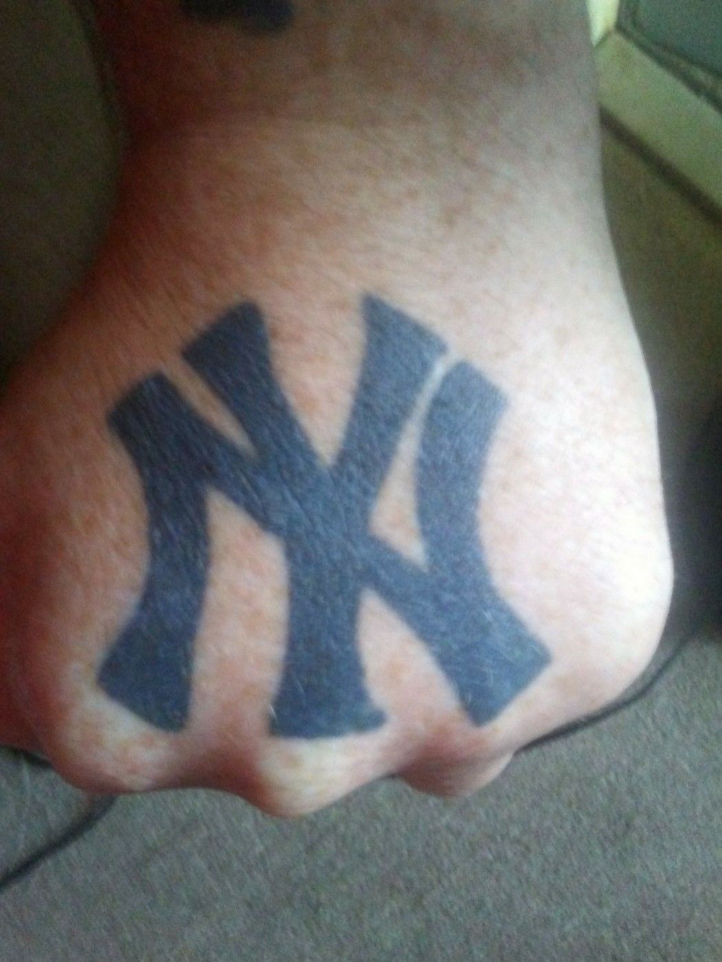 NY Yankees logo tattoo