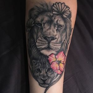 A family tattoo, the lions symbolize me and my father our zodiac signs are Lion. The pink/yellow flower is symbolizing my mother and she's a lion as well but I choose the flower for the zodiac sign insted, and at last we have two flowers left which is my sisters who both are born in april and then have the flower of april.